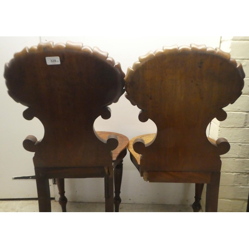 328 - A pair of William IV mahogany hall chairs, the shell and twin C-scrolled back, over a solid seat, ra... 