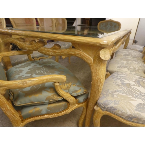 331 - A modern French hunting lodge style, naturally carved, bleached light oak dining table with a glass ... 