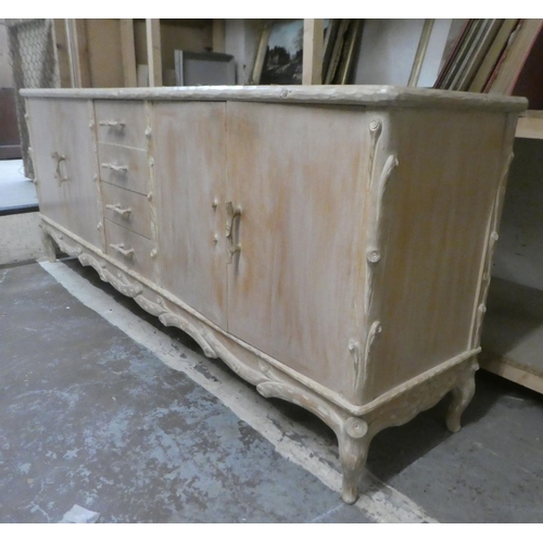 332 - A modern French hunting lodge style, naturally carved, bleached light oak sideboard with a central b... 