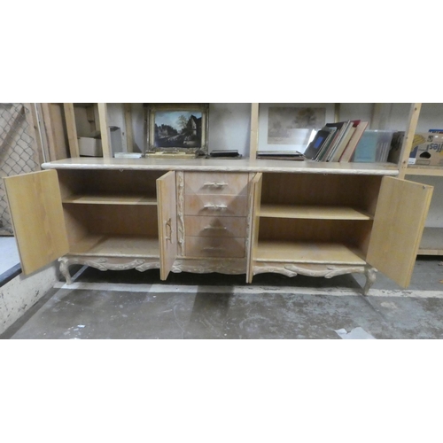 332 - A modern French hunting lodge style, naturally carved, bleached light oak sideboard with a central b... 