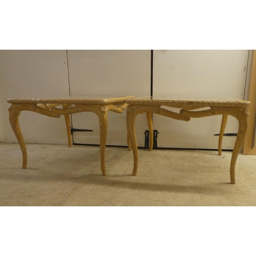 336 - A pair of modern French hunting lodge style, naturally carved, bleached light oak lamp tables with g... 