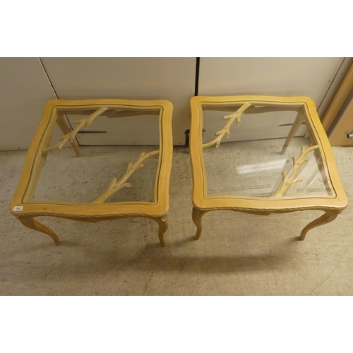 336 - A pair of modern French hunting lodge style, naturally carved, bleached light oak lamp tables with g... 