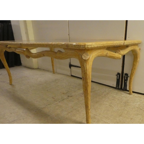 337 - A modern French hunting lodge style, naturally carved, bleached light oak framed coffee table with a... 