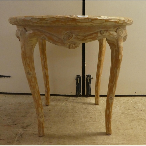 338 - A modern French hunting lodge style, naturally carved, bleached light oak framed coffee table, raise... 