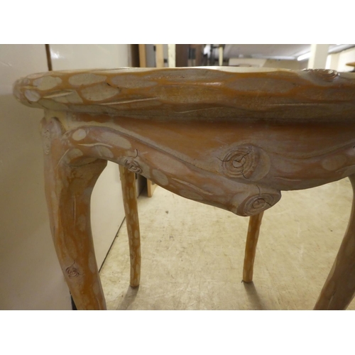 338 - A modern French hunting lodge style, naturally carved, bleached light oak framed coffee table, raise... 