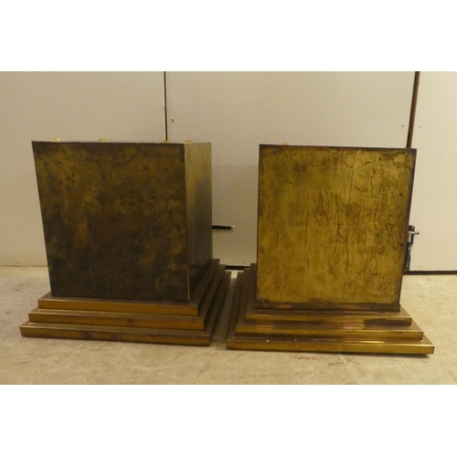 343 - A pair of Art Deco inspired cast metal pedestals, on a stepped plinth  18