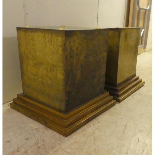 343 - A pair of Art Deco inspired cast metal pedestals, on a stepped plinth  18