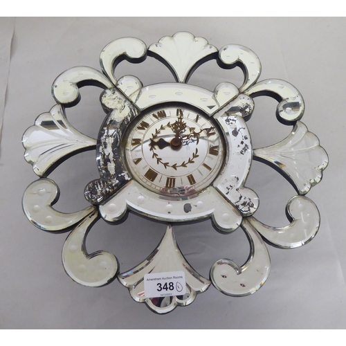 348 - A mid 20thC Venetian design, mirrored panelled wall timepiece; the Garrard movement faced by a Roman... 