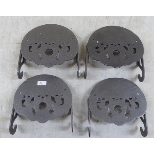 74 - A set of four novelty cast iron toilet roll holders, branded for 'GWR'  5