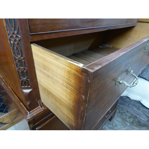 105 - A George III mahogany chest-on-chest with a broken arch cornice and Greek Key style dentil moulding,... 