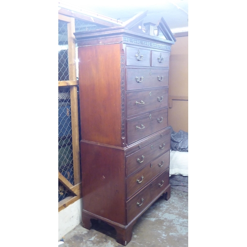105 - A George III mahogany chest-on-chest with a broken arch cornice and Greek Key style dentil moulding,... 