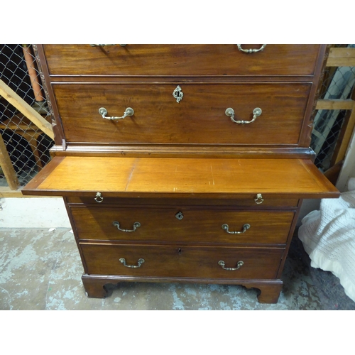 105 - A George III mahogany chest-on-chest with a broken arch cornice and Greek Key style dentil moulding,... 