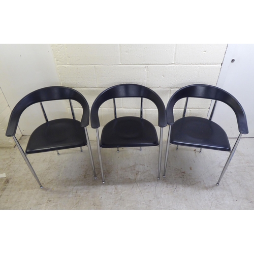 116 - A set of three modern Arper, Italy stainless steel framed dining chairs with moulded and stitched bl... 