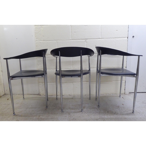 116 - A set of three modern Arper, Italy stainless steel framed dining chairs with moulded and stitched bl... 