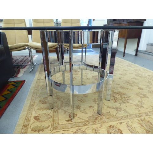 138 - A chromium plated table base with fixed, planked supports and a drop-in tinted glass top  29