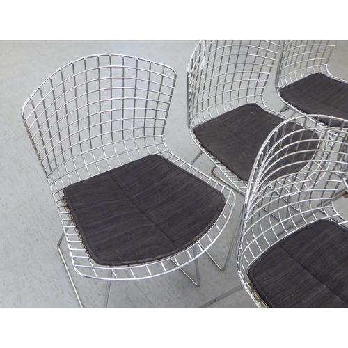 139 - A set of five Bertoia design chromium plated chairs with charcoal coloured, fabric covered cushion s... 