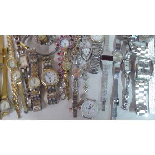 149 - Variously cased wristwatches: to include a Timex, faced by a baton dial