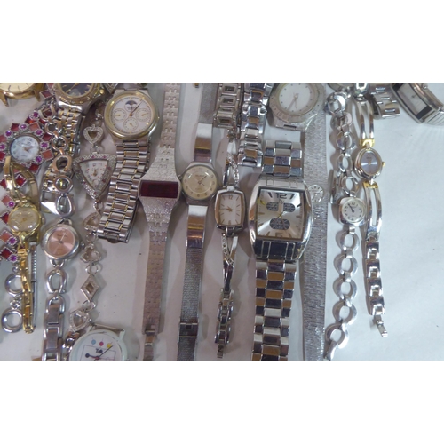 149 - Variously cased wristwatches: to include a Timex, faced by a baton dial