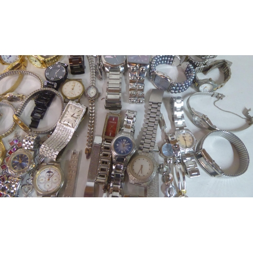 149 - Variously cased wristwatches: to include a Timex, faced by a baton dial