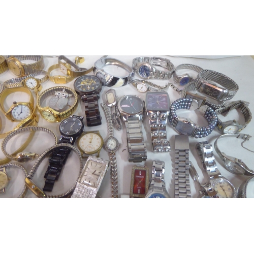 149 - Variously cased wristwatches: to include a Timex, faced by a baton dial