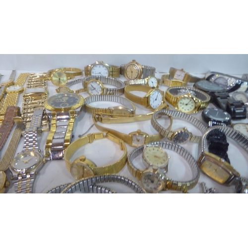 149 - Variously cased wristwatches: to include a Timex, faced by a baton dial