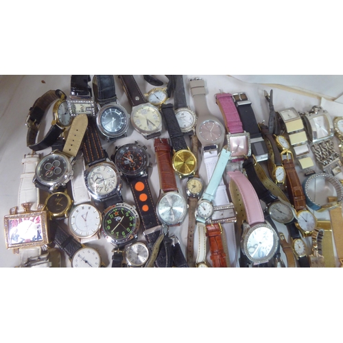 149 - Variously cased wristwatches: to include a Timex, faced by a baton dial