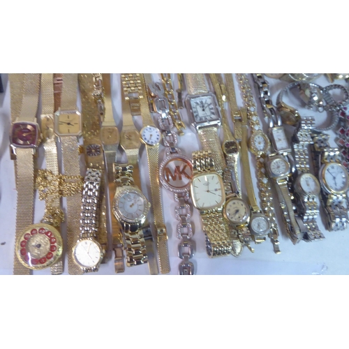 149 - Variously cased wristwatches: to include a Timex, faced by a baton dial