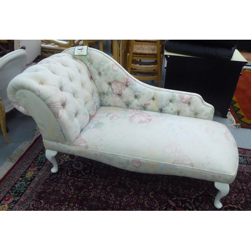 184 - A child's modern Edwardian style nursery chaise longue, decorated in floral patterned, white and pas... 