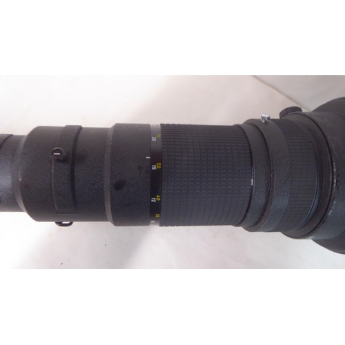 186 - A Nikon Nikkor 800mm 1:5.6 photographic lens, in a padded bag