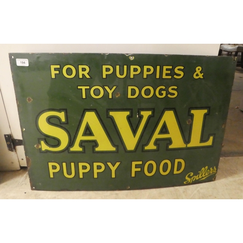 194 - A vintage cast iron, yellow on green, enamel advertising sign for 'Saval Puppy Food'  20