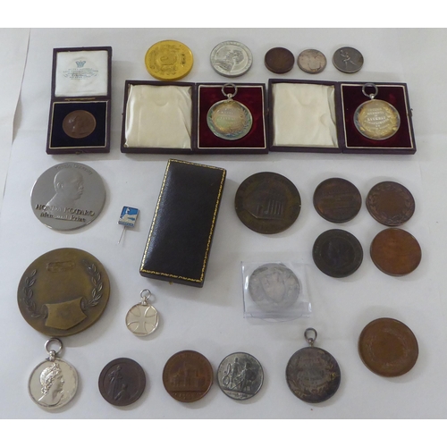 197 - White metal, bronze and other medallions and awards: to include a 1902 example