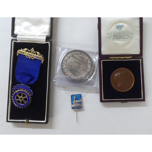 197 - White metal, bronze and other medallions and awards: to include a 1902 example