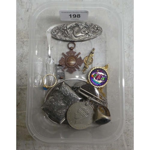 198 - Silver collectables and items of personal ornament: to include a yellow metal ring, set with a blue ... 