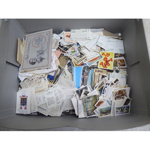 207 - Uncollated used postcards and cigarette cards: to include examples by Black Cat