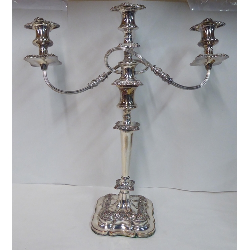 21 - A pair of 20thC Victorian style, silver plated, twin branch candelabra  20