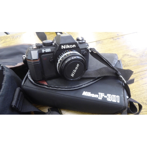 212 - Photographic equipment: to include a Nikon D3100 camera; and a Hanimar auto lens