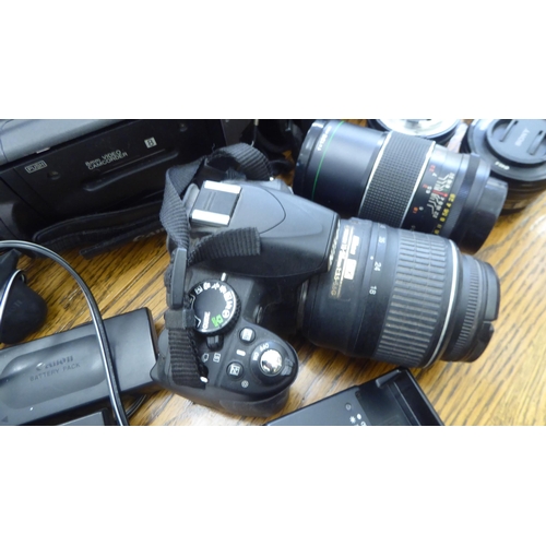 212 - Photographic equipment: to include a Nikon D3100 camera; and a Hanimar auto lens