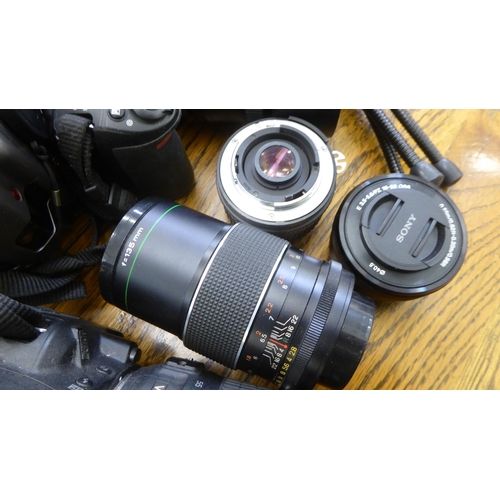 212 - Photographic equipment: to include a Nikon D3100 camera; and a Hanimar auto lens