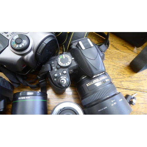 212 - Photographic equipment: to include a Nikon D3100 camera; and a Hanimar auto lens