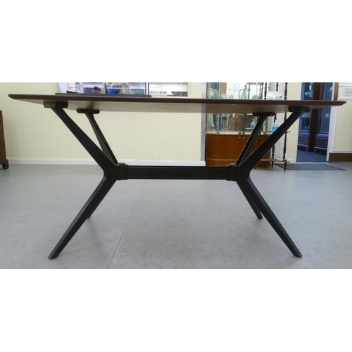 220 - A G-Plan Tola teak dining table, raised on a black painted splayed underframe  29