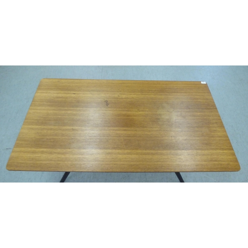 220 - A G-Plan Tola teak dining table, raised on a black painted splayed underframe  29