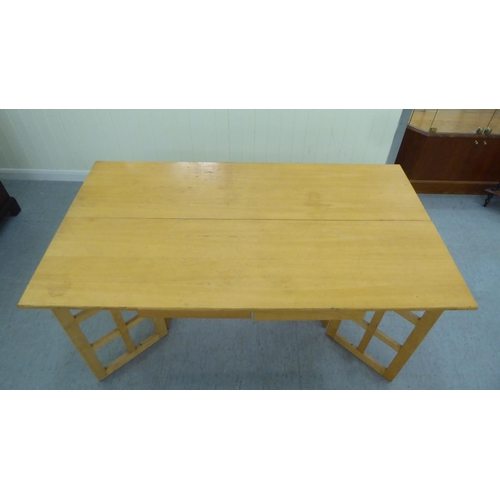 228 - A modern beech gateleg folding dining table  29