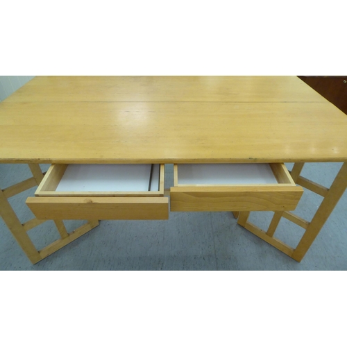 228 - A modern beech gateleg folding dining table  29