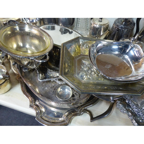 23 - Silver plated and pewter tableware: to include a claret jug; tureens; and serving trays  various des... 