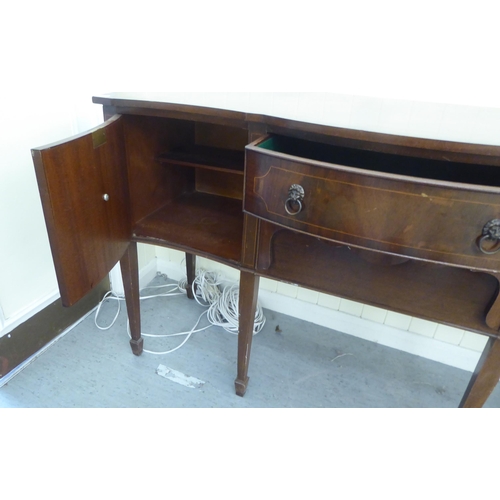 230 - A 20thC reproduction of a Georgian string inlaid mahogany breakfront bow sideboard, raised on square... 