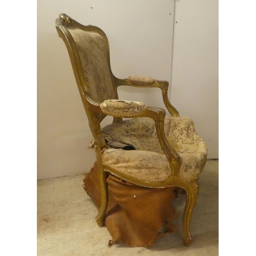 235 - An early 20thC French inspired gilt framed open salon chair, raised on cabriole forelegs