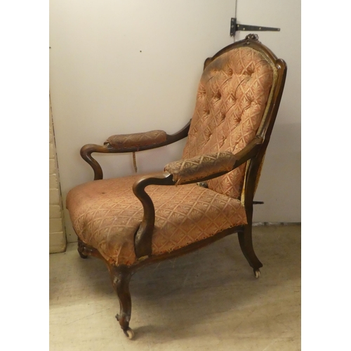 239 - A late Victorian mahogany showwood framed, open arm salon chair, raised on floral carved cabriole fo... 