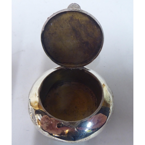 24 - Silver and white metal collectables: to include a ring box; and a cigarette case  mixed marks