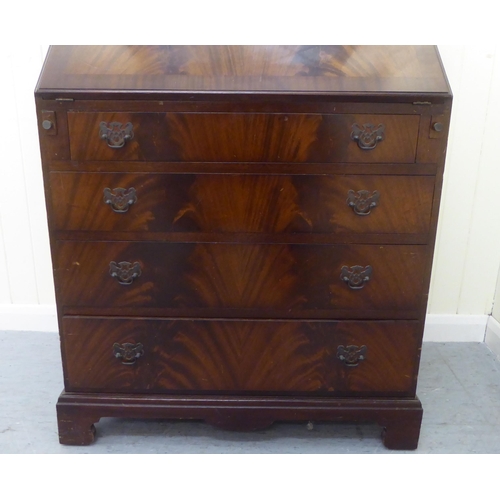 246 - A reproduction mahogany bureau bookcase, the upper section over a fall flap, over four graduated dra... 