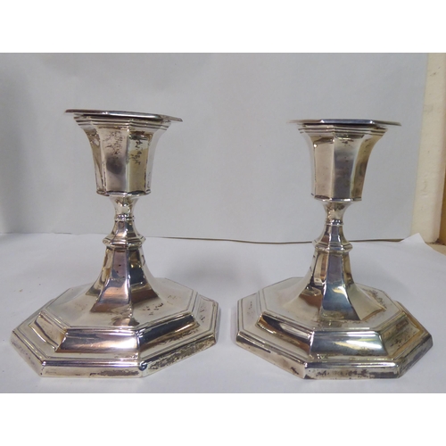 31 - Two pairs of dissimilar loaded silver candlesticks  mixed marks  8